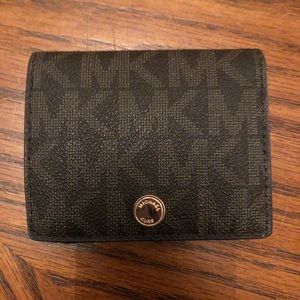 Brown! Michael Kors Tri-fold wallet.